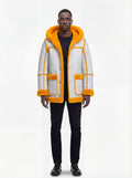 Male model wearing Maverick Axel Hooded Shearling Parka, relaxed fit, styled with black crewneck t-shirt and black slim-fit jeans. Maverick Jacket.