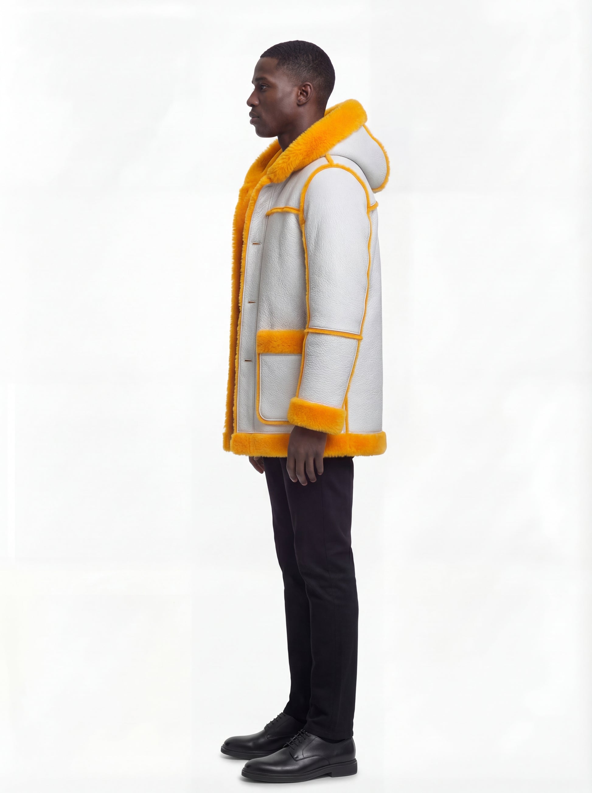 Side profile of Maverick Axel Hooded Shearling Parka showing fur cuff detail and straight mid-length silhouette. Maverick Jacket.