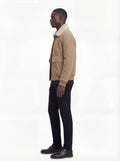 Side profile of Maverick Finn bomber jacket showing ribbed cuff detail and straight silhouette. Maverick Jacket.