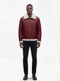 Male model wearing Maverick Cormac shearling aviator jacket, regular fit, styled with black slim-fit jeans. Maverick Jacket.
