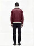 Rear view of male model wearing Maverick Cormac shearling aviator jacket showing structured shoulder fit and shearling-trimmed hem. Maverick Jacket.