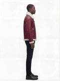 Side profile of Maverick Cormac shearling aviator jacket showing zippered sleeve pocket and shearling cuff. Maverick Jacket.