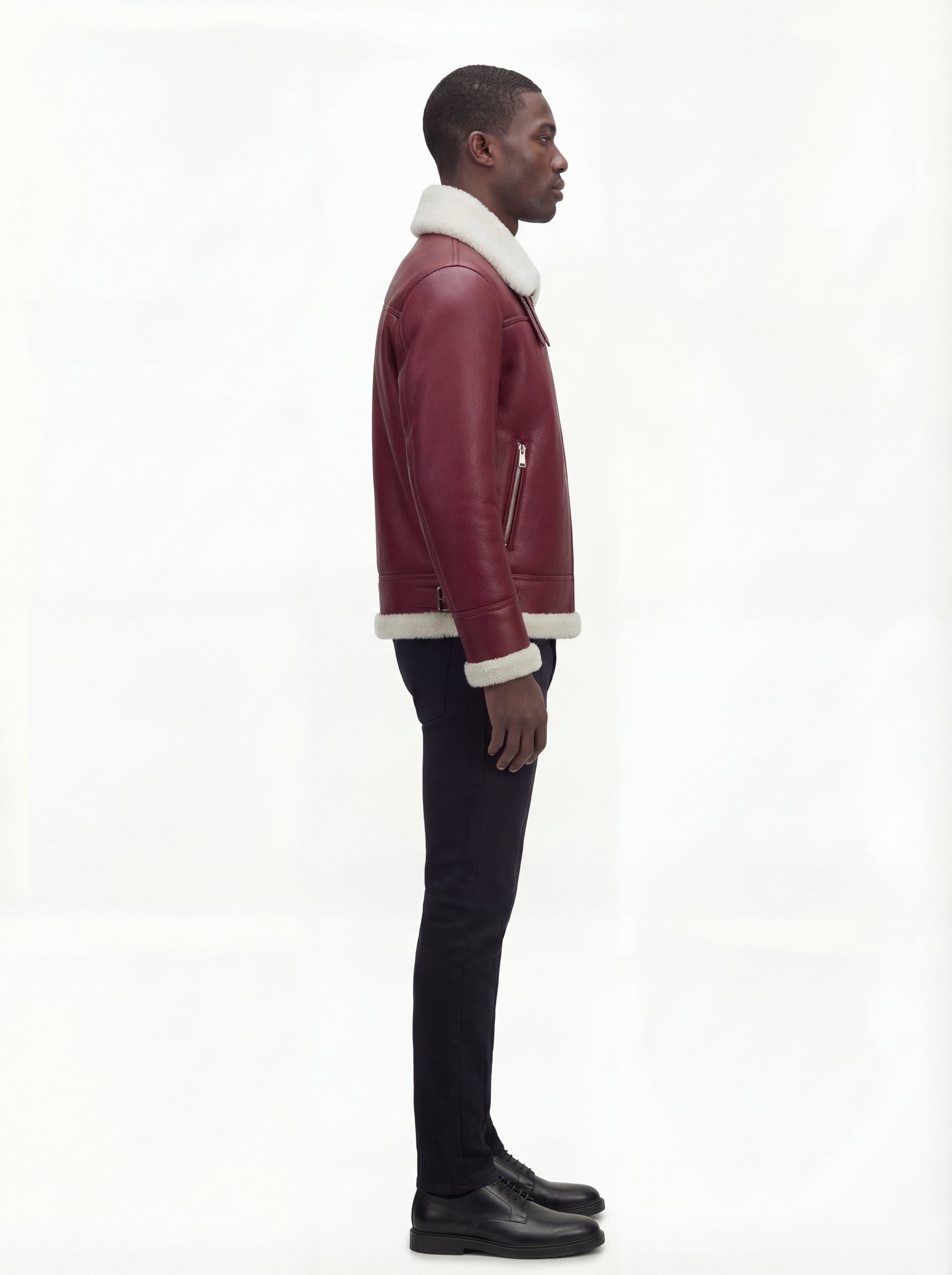 Side profile of Maverick Cormac shearling aviator jacket showing zippered sleeve pocket and shearling cuff. Maverick Jacket.