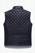 Rear view of black quilted leather vest showing diamond quilt stitching and clean hem. The Graham by Maverick Jacket.