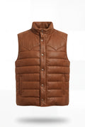 Men's tan suede and nylon western puffer vest with pointed shoulder yoke and snap button closure, Front View. The Nash by Maverick Jacket.