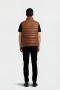 Rear view of male model wearing Maverick Nash western puffer vest showing structured shoulder yoke and insulated back styling. Maverick Jacket.