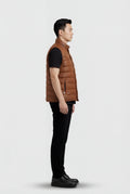 Side profile of Maverick Nash western puffer vest showing armhole binding and insulated puffy silhouette. Maverick Jacket.