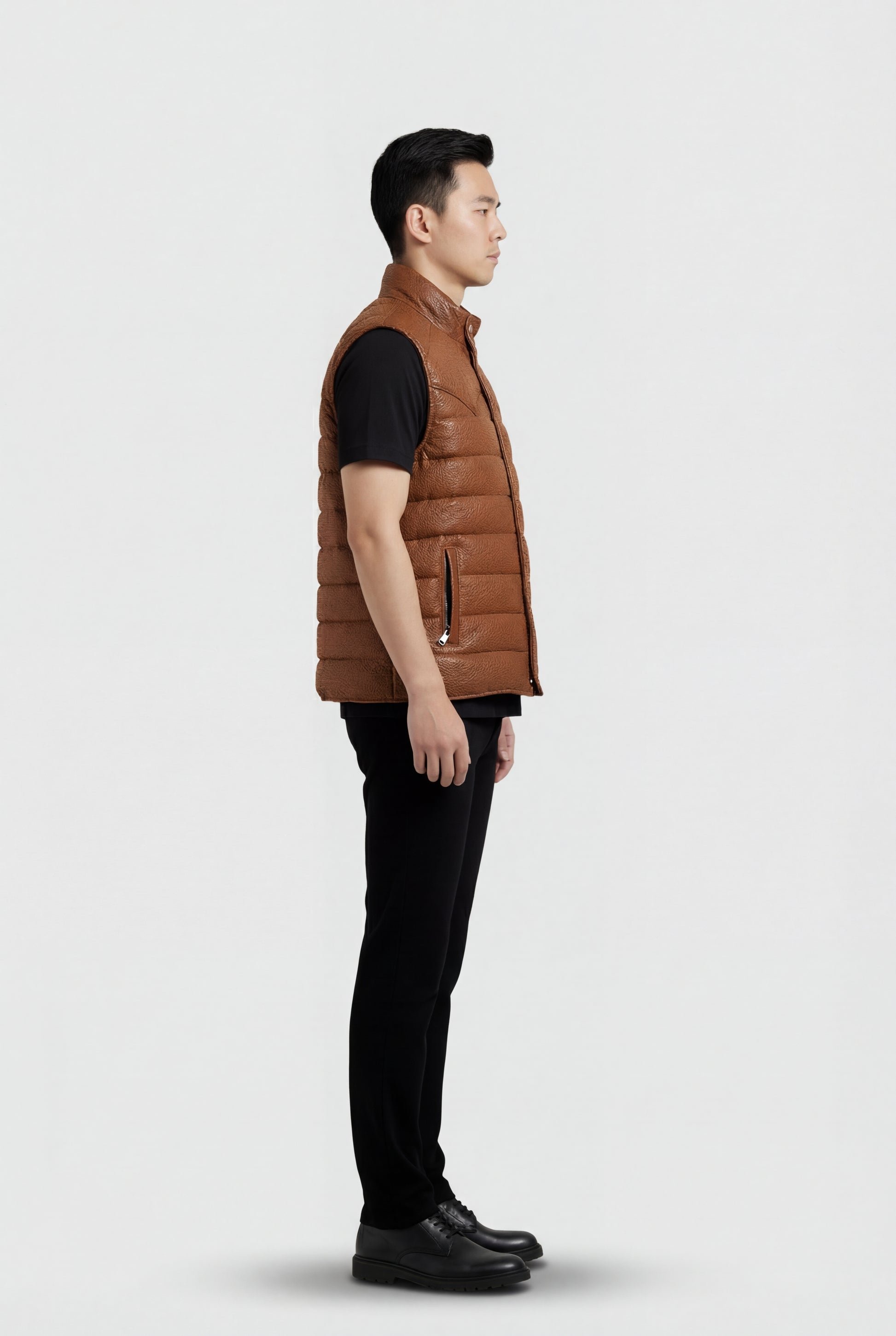 Side profile of Maverick Nash western puffer vest showing armhole binding and insulated puffy silhouette. Maverick Jacket.