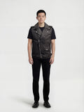 Male model wearing Maverick Ryder leather biker vest, regular fit, styled over a grey hoodie with black distressed denim jeans. Maverick Jacket.