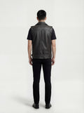 Rear view of male model wearing Maverick Ryder leather biker vest showing broad shoulder fit and clean back yoke styling. Maverick Jacket.