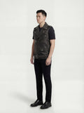 Side profile of Maverick Ryder leather biker vest showing deep armhole cut and boxy biker silhouette. Maverick Jacket.