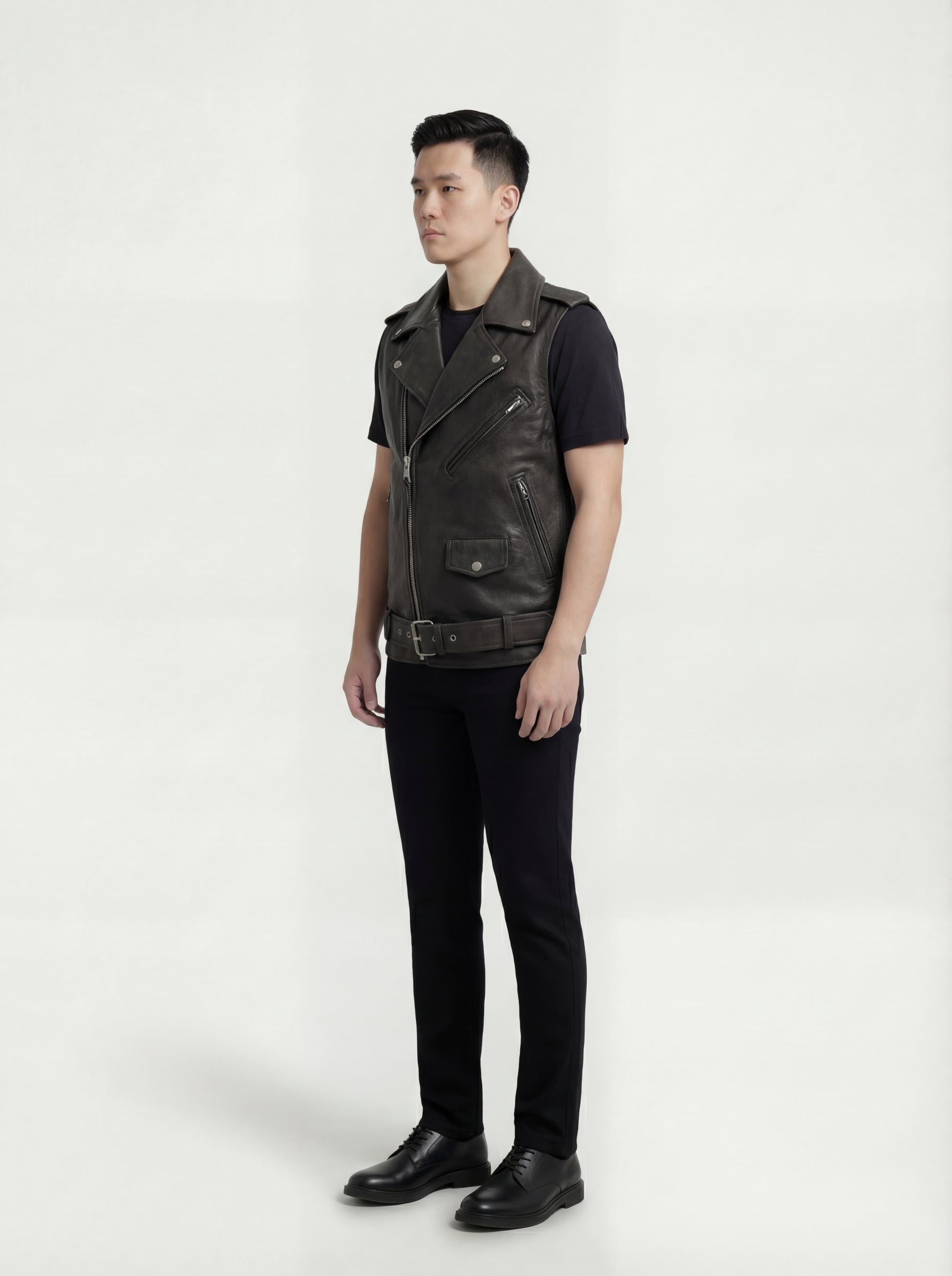 Side profile of Maverick Ryder leather biker vest showing deep armhole cut and boxy biker silhouette. Maverick Jacket.