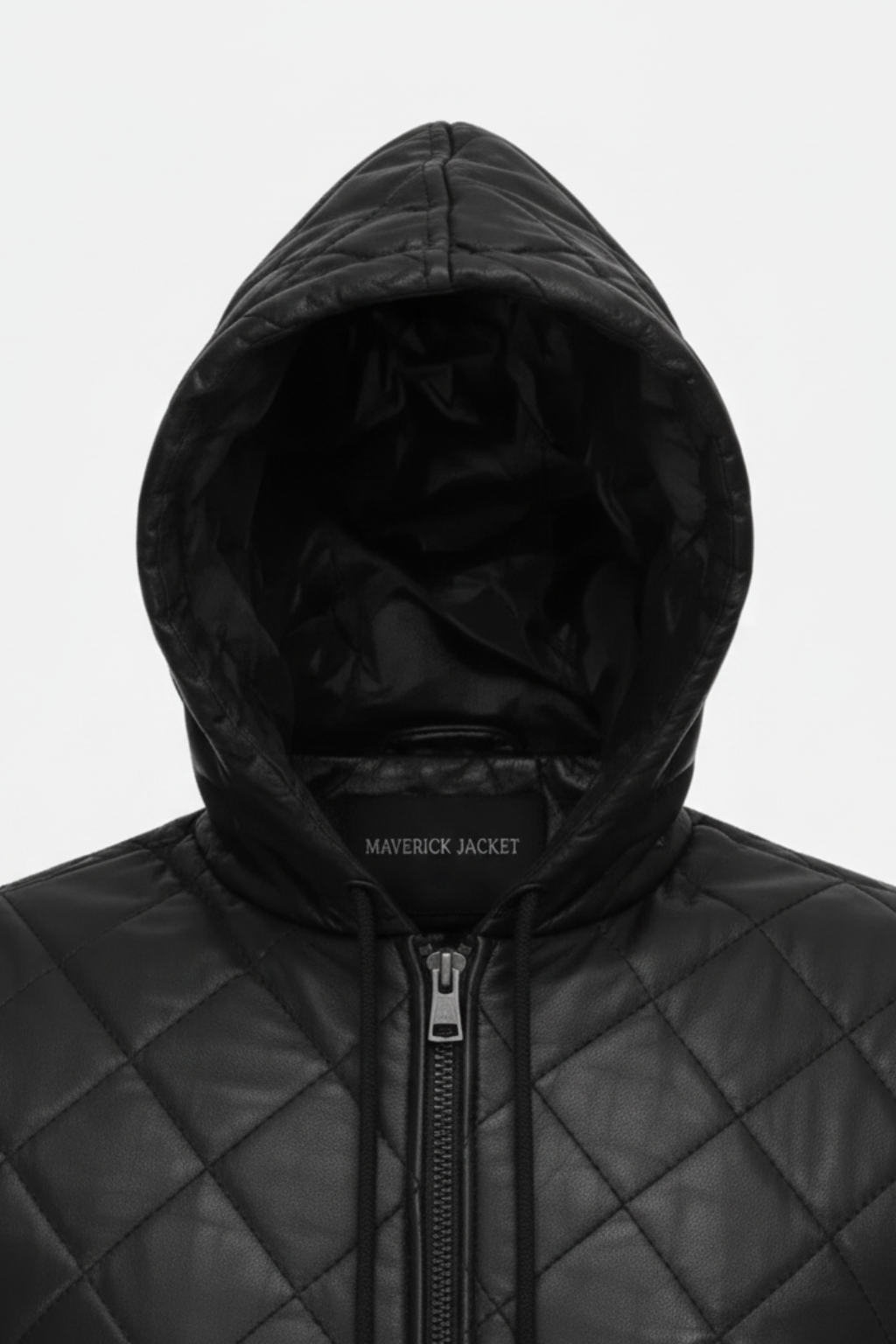 Macro shot of diamond quilted leather texture and silver zipper hardware on hooded vest. The Reid by Maverick Jacket.