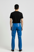 Rear view of male model wearing Maverick Enzo leather cargo pants showing tailored seat fit and straight hem styling. Maverick Jacket.
