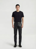 Male model wearing Maverick Jett quilted leather moto pants, slim fit, styled with black crew neck t-shirt and black leather derby shoes. Maverick Jacket.