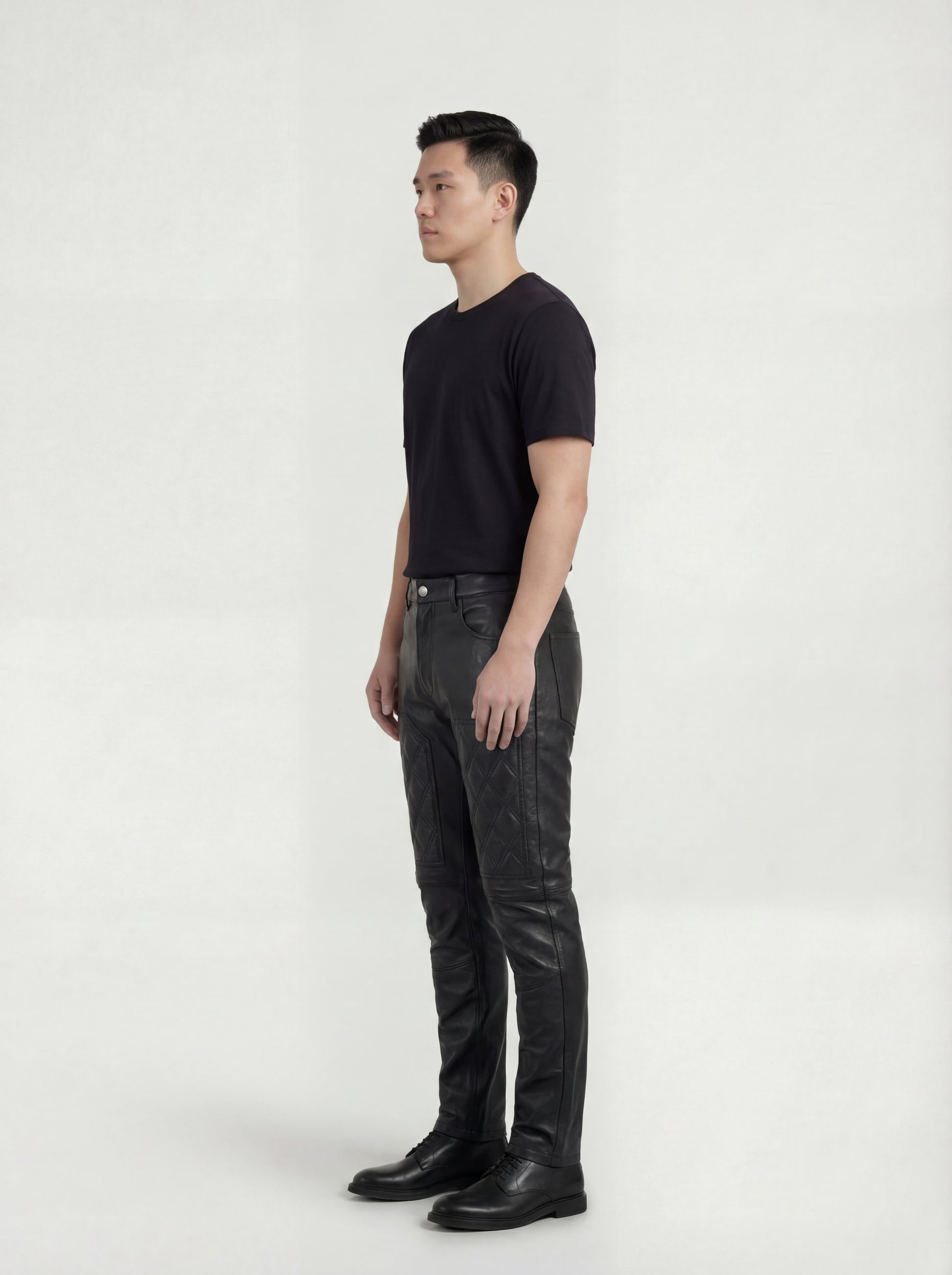 Side profile of Maverick Jett leather moto pants showing quilted thigh construction and streamlined leg fit. Maverick Jacket.