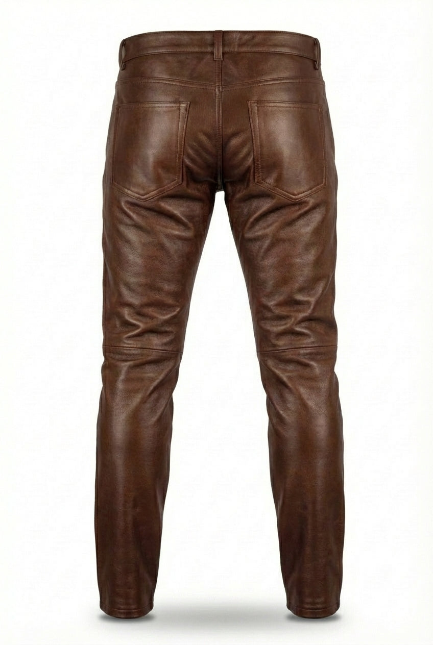 Rear view of brown leather pants showing rear patch pockets and horizontal knee seam detailing. The Nolan by Maverick Jacket.