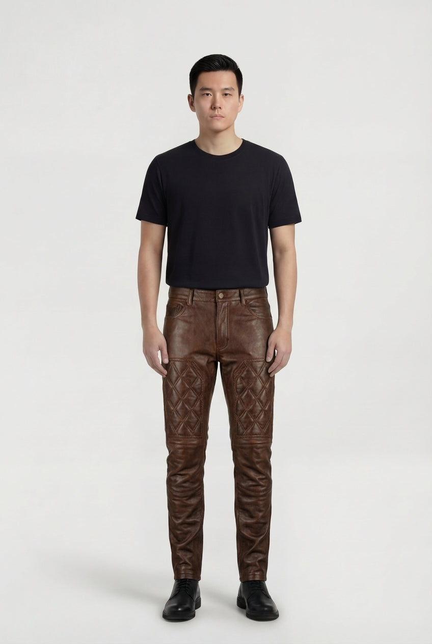 Male model wearing Maverick Nolan quilted leather pants, slim fit, styled with black crew neck t-shirt and black leather derby shoes. Maverick Jacket.