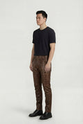 Side profile of Maverick Nolan leather pants showing quilted knee construction and straight leg fit. Maverick Jacket.