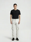 Male model wearing Maverick Cassian white leather cargo pants, straight fit, styled with black crew neck t-shirt and black leather derby shoes. Maverick Jacket.