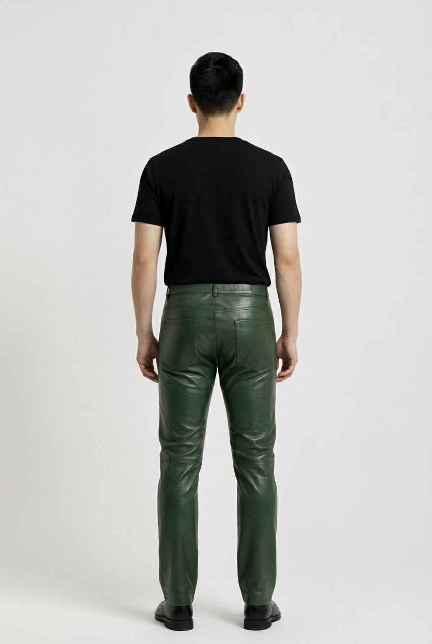 Rear view of male model wearing Maverick Finnian forest green leather pants showing fitted seat silhouette and straight leg cut. Maverick Jacket.