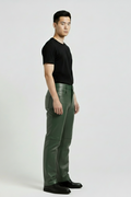 Side profile of Maverick Finnian forest green leather pants showing knee seam construction and straight leg fit. Maverick Jacket.
