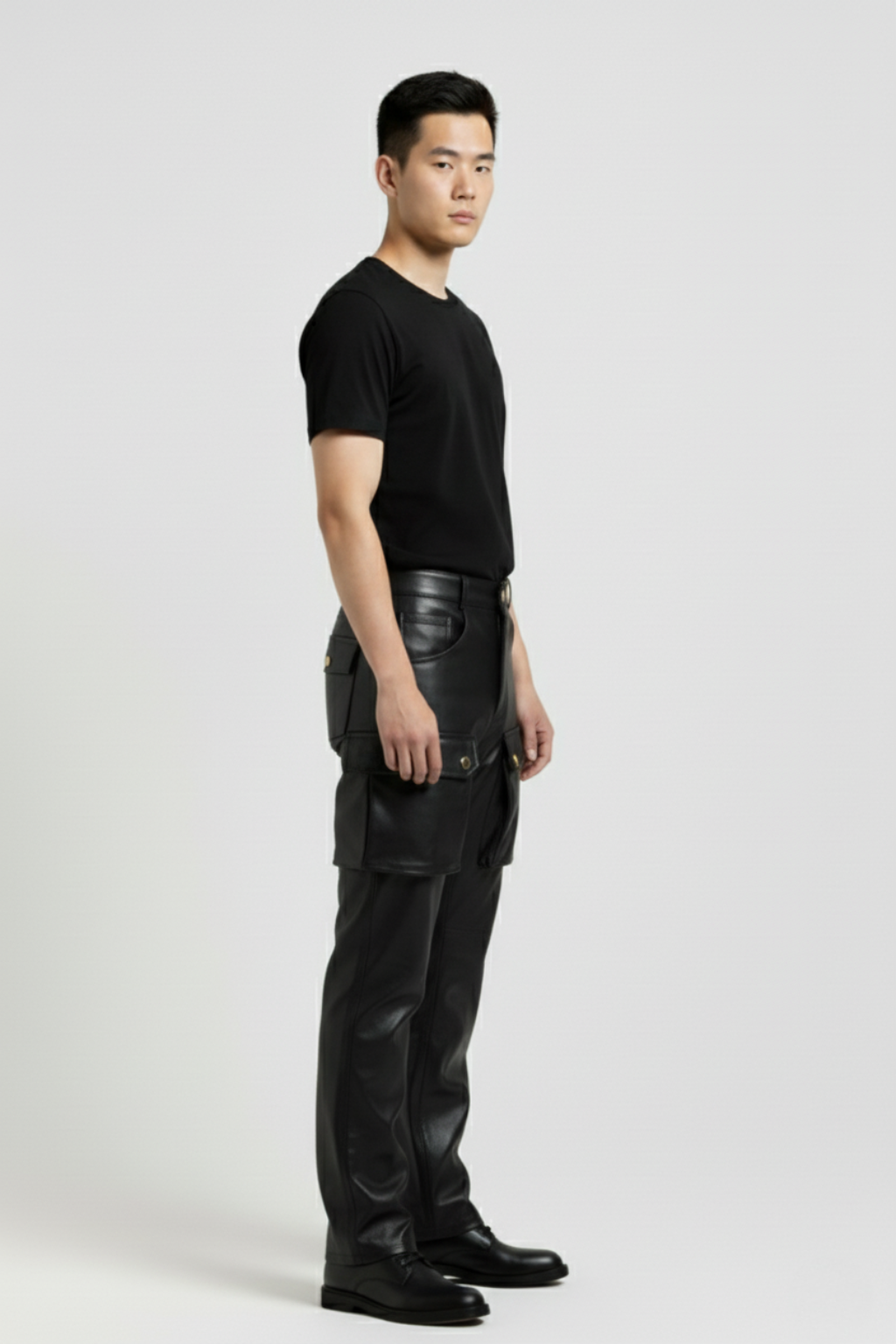 Side profile of Maverick Tristan leather cargo pants showing dimensional cargo pocket structure and straight leg fit. Maverick Jacket.