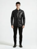 Male model wearing Maverick Damien croc-embossed leather shirt, slim fit, styled with black skinny jeans. Maverick Jacket.