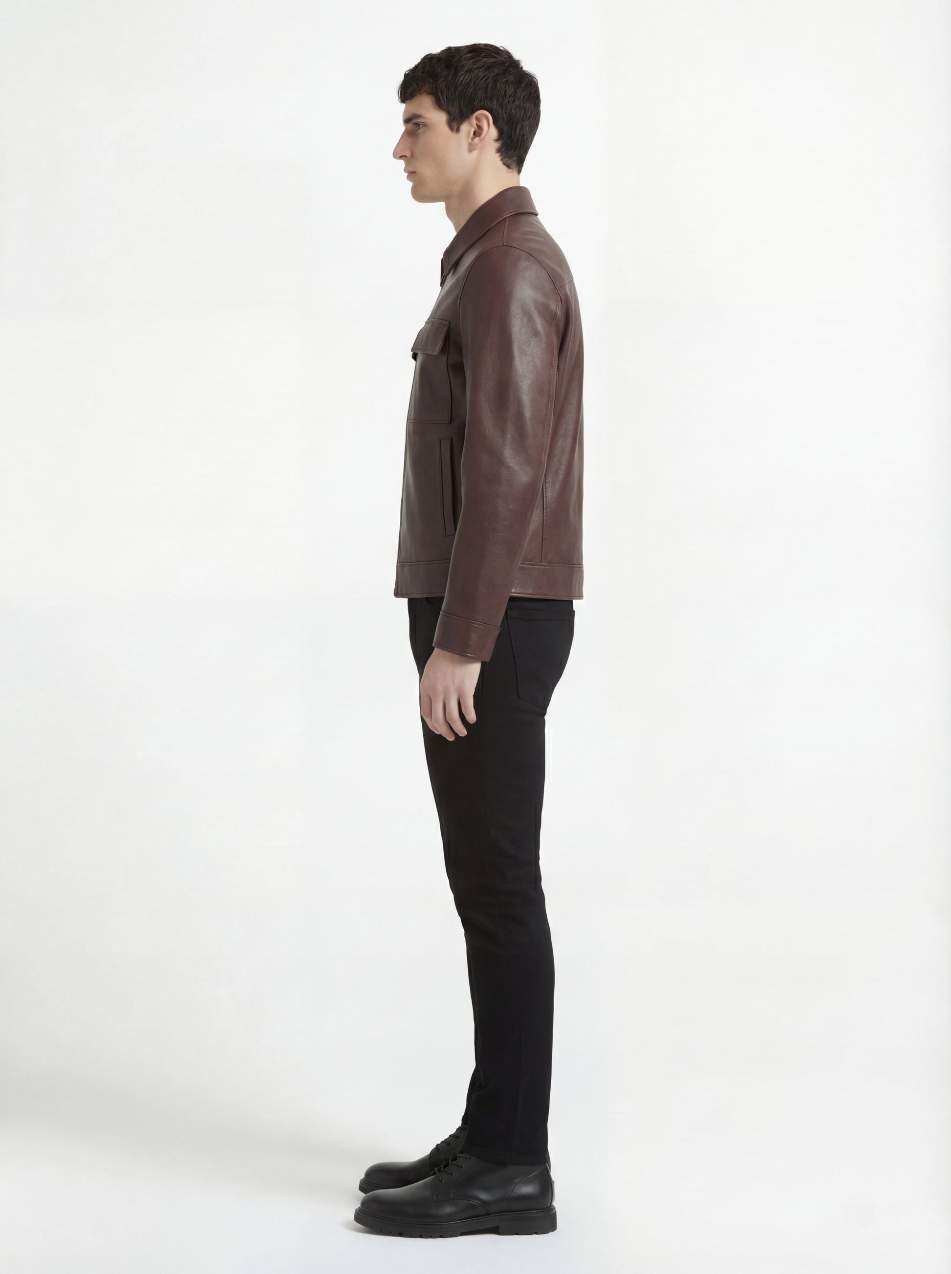 Side profile of Maverick Elliot leather zip-front shirt showing full sleeve structure and clean torso silhouette. Maverick Jacket.