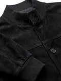 Macro shot of soft black suede texture and metal zipper hardware on bomber jacket. The Soren by Maverick Jacket.