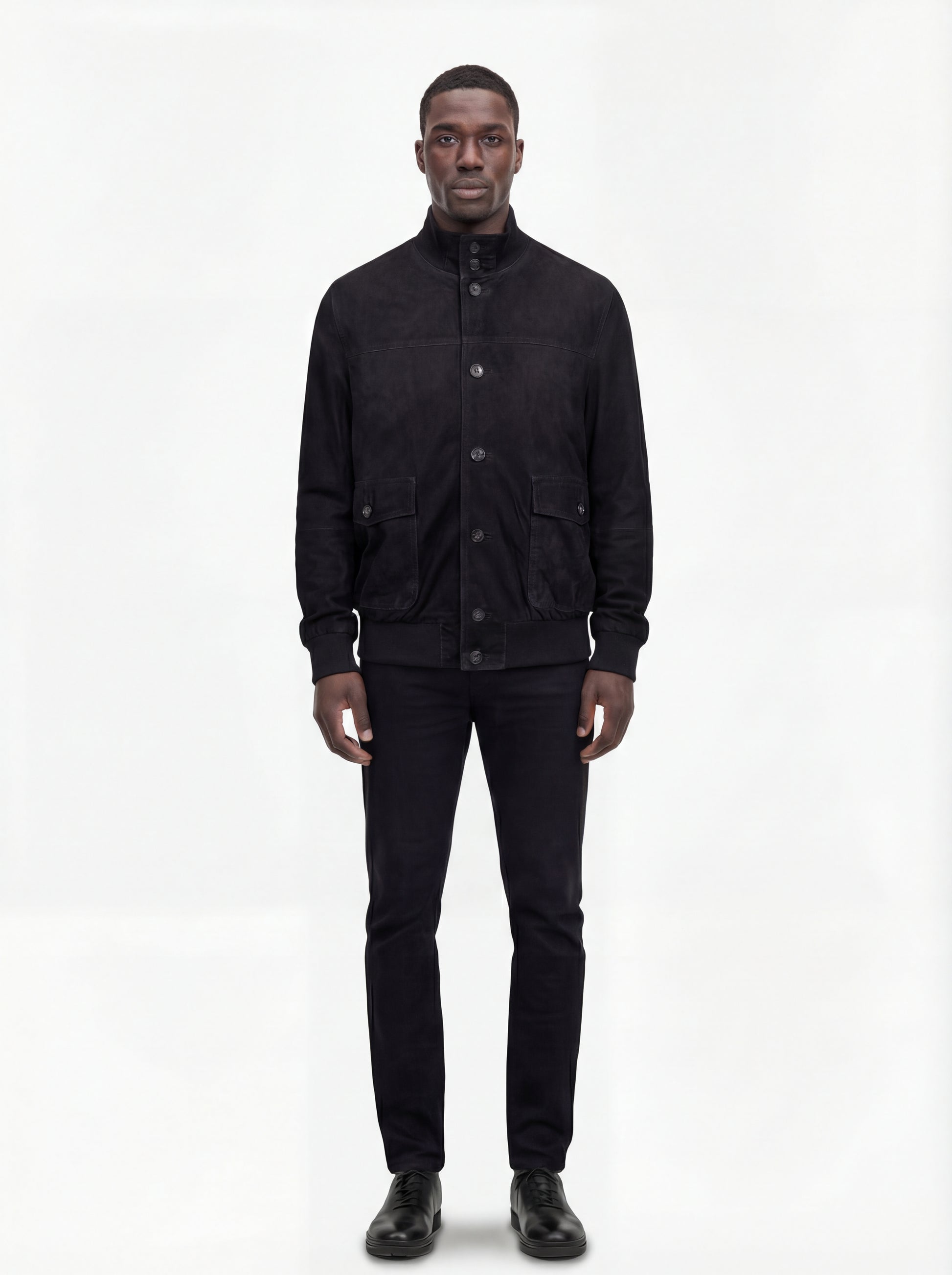 Male model wearing Maverick Soren suede bomber jacket, regular fit, styled with black jeans. Maverick Jacket.