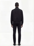 Rear view of male model wearing Maverick Soren suede bomber jacket showing broad shoulder fit and ribbed waist styling. Maverick Jacket.