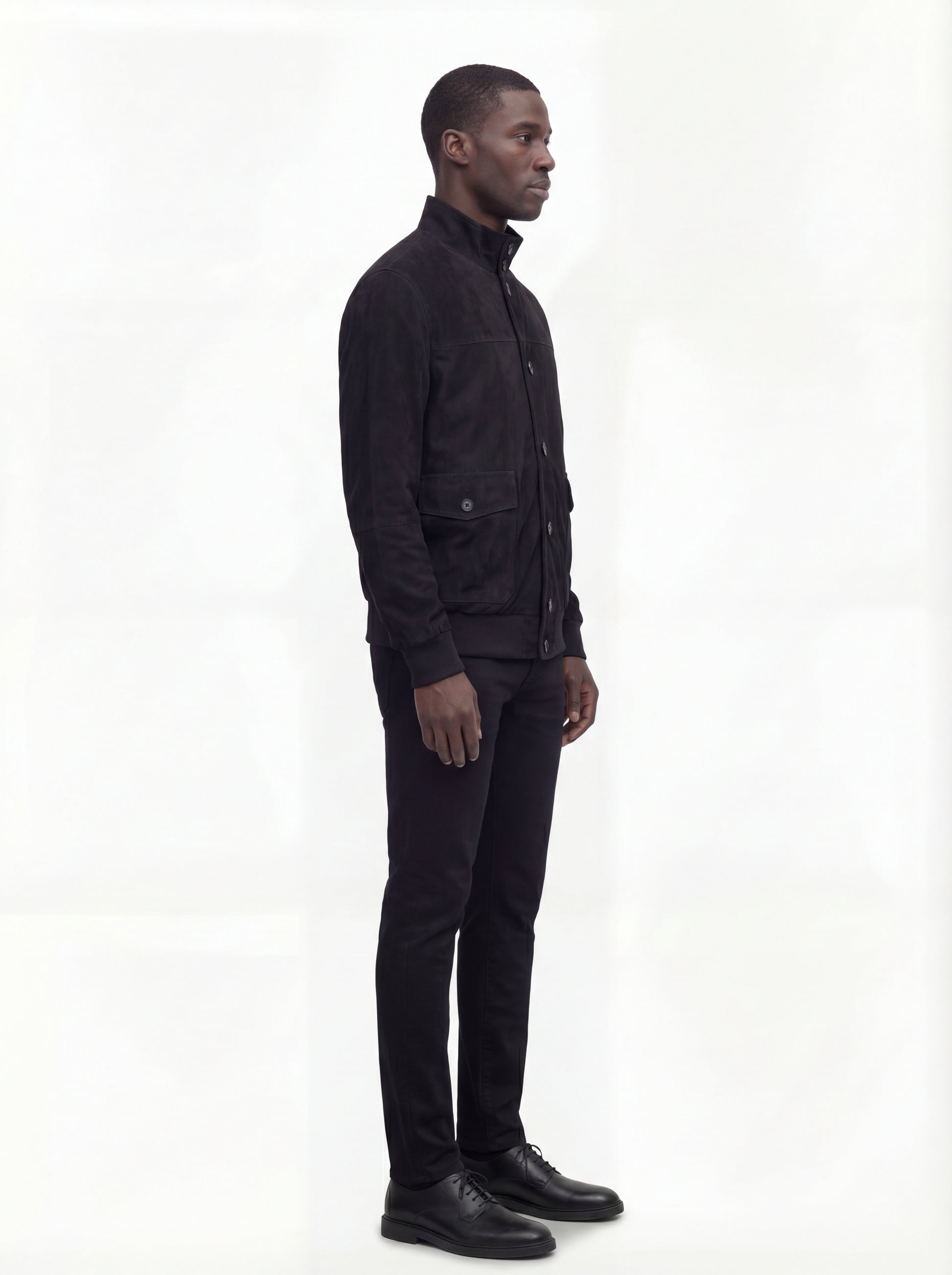 Side profile of Maverick Soren suede bomber jacket showing ribbed sleeve cuffs and classic bomber silhouette. Maverick Jacket.