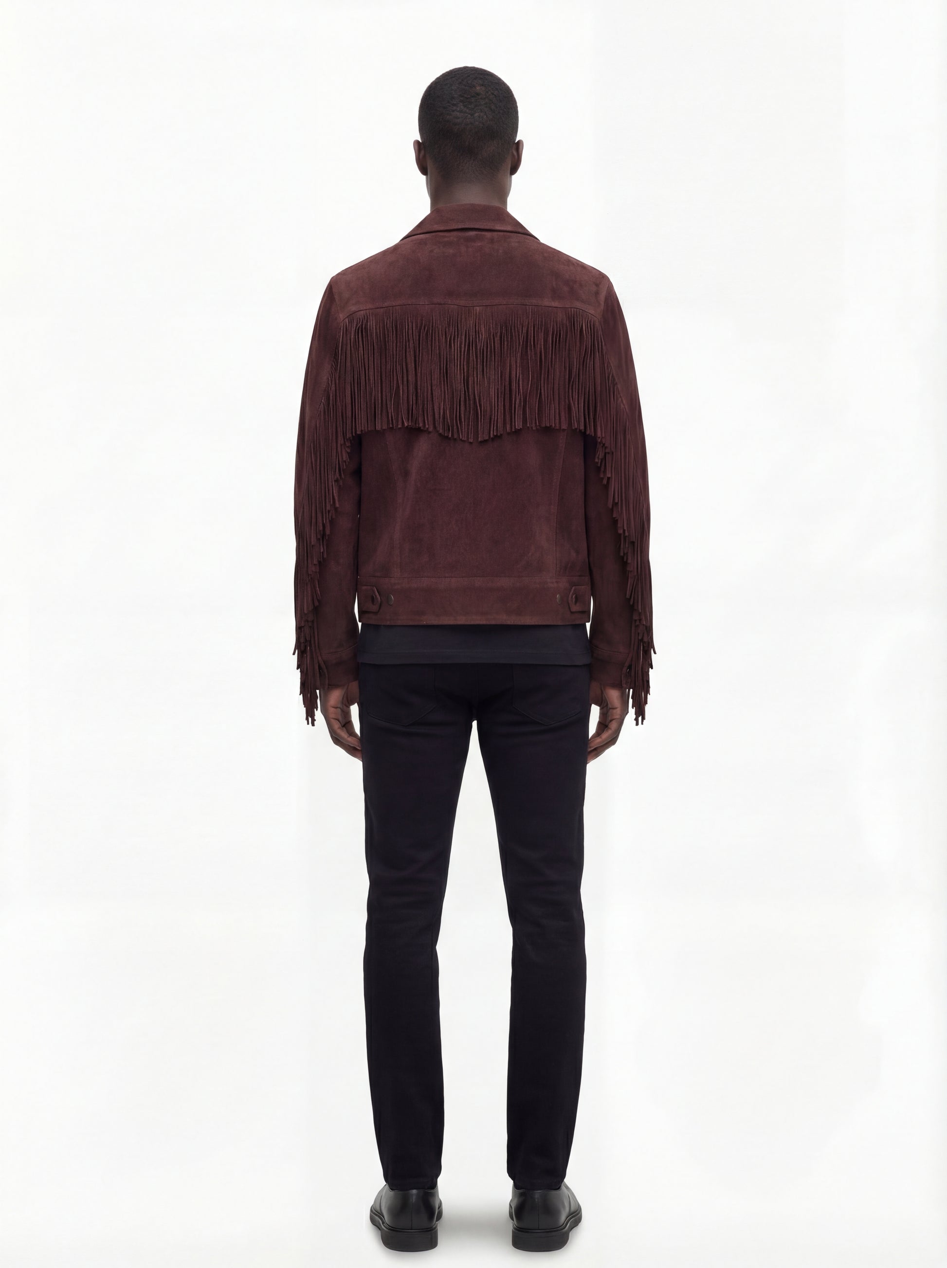 Rear view of male model wearing Maverick Boone suede fringe jacket showing broad shoulder fit and back fringe styling. Maverick Jacket.