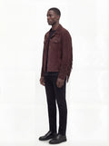 Side profile of Maverick Boone suede fringe jacket showing sleeve fringe movement and straight silhouette. Maverick Jacket.