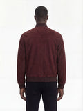 Rear view of male model wearing Maverick Miles suede bomber jacket showing broad shoulder fit and ribbed waist styling. Maverick Jacket.