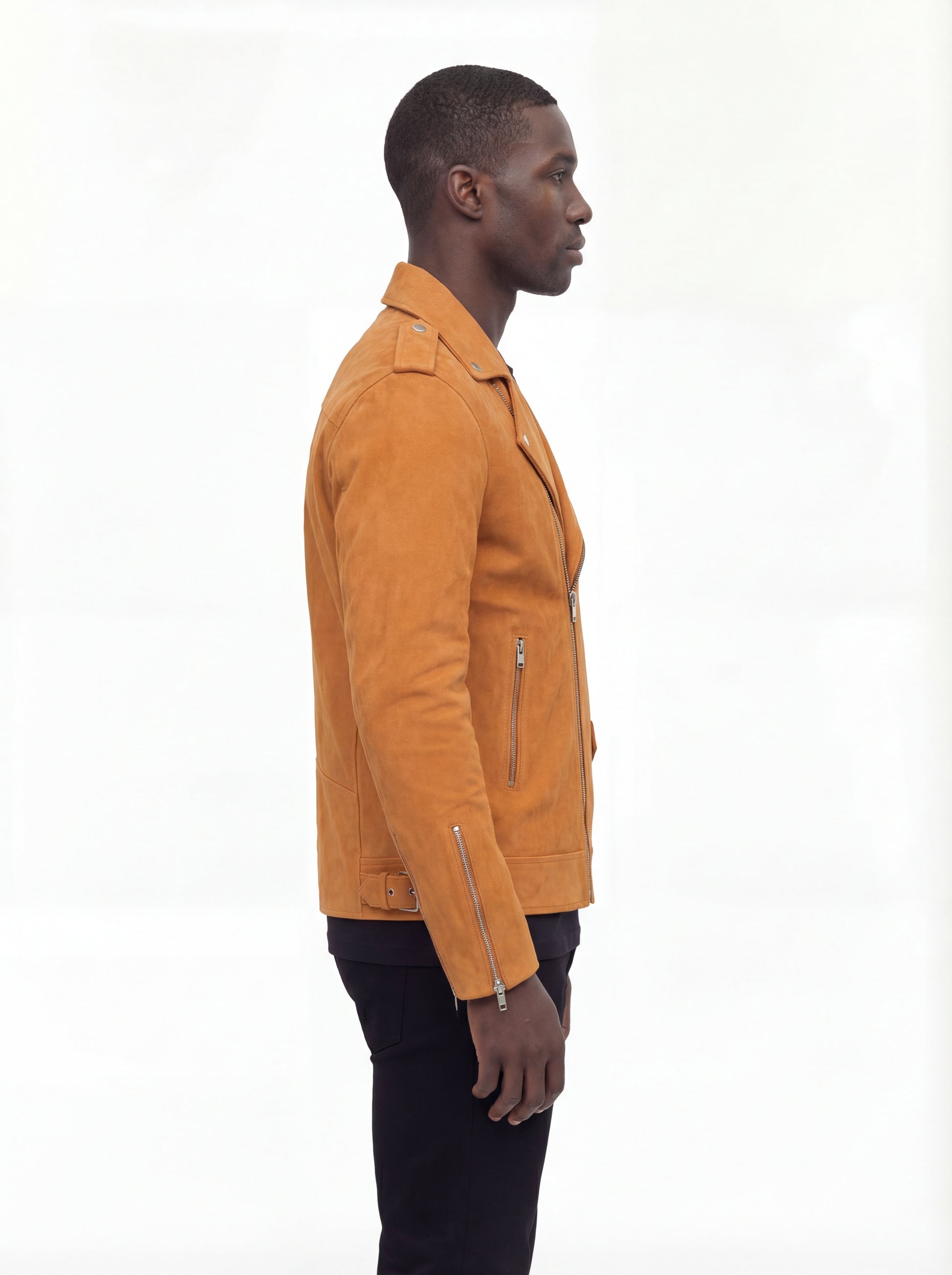 Side profile of Maverick Dylan suede biker jacket showing zippered sleeve cuffs and cropped silhouette. Maverick Jacket.