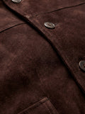 Macro shot of soft brown suede texture and metal zipper hardware on bomber jacket. The Arthur by Maverick Jacket.