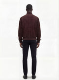 Rear view of male model wearing Maverick Arthur suede bomber jacket showing broad shoulder fit and ribbed waist styling. Maverick Jacket.