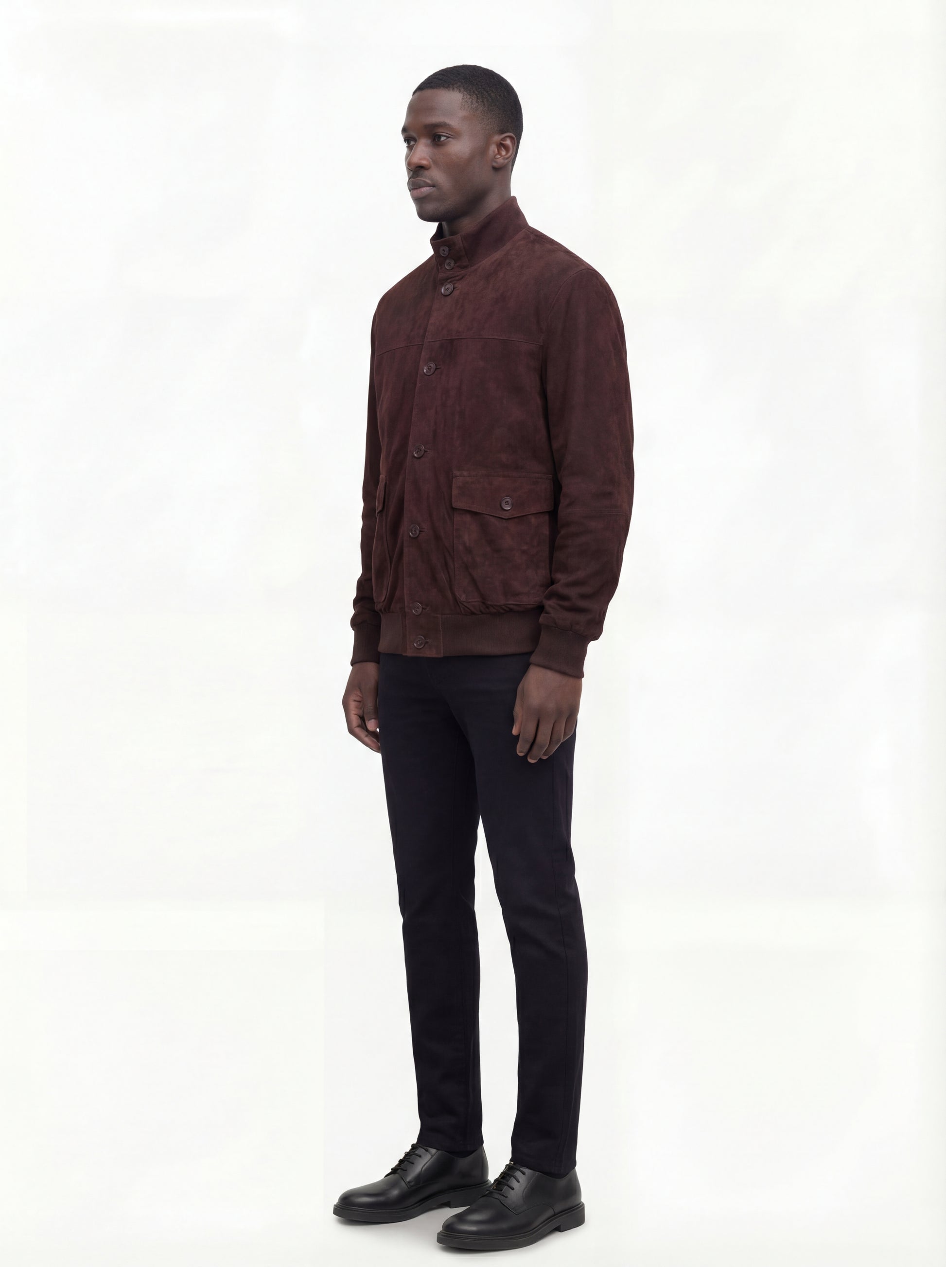 Side profile of Maverick Arthur suede bomber jacket showing ribbed sleeve cuffs and classic bomber silhouette. Maverick Jacket.