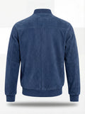 Rear view of blue suede bomber jacket showing clean back paneling and ribbed hem. The Jude by Maverick Jacket.