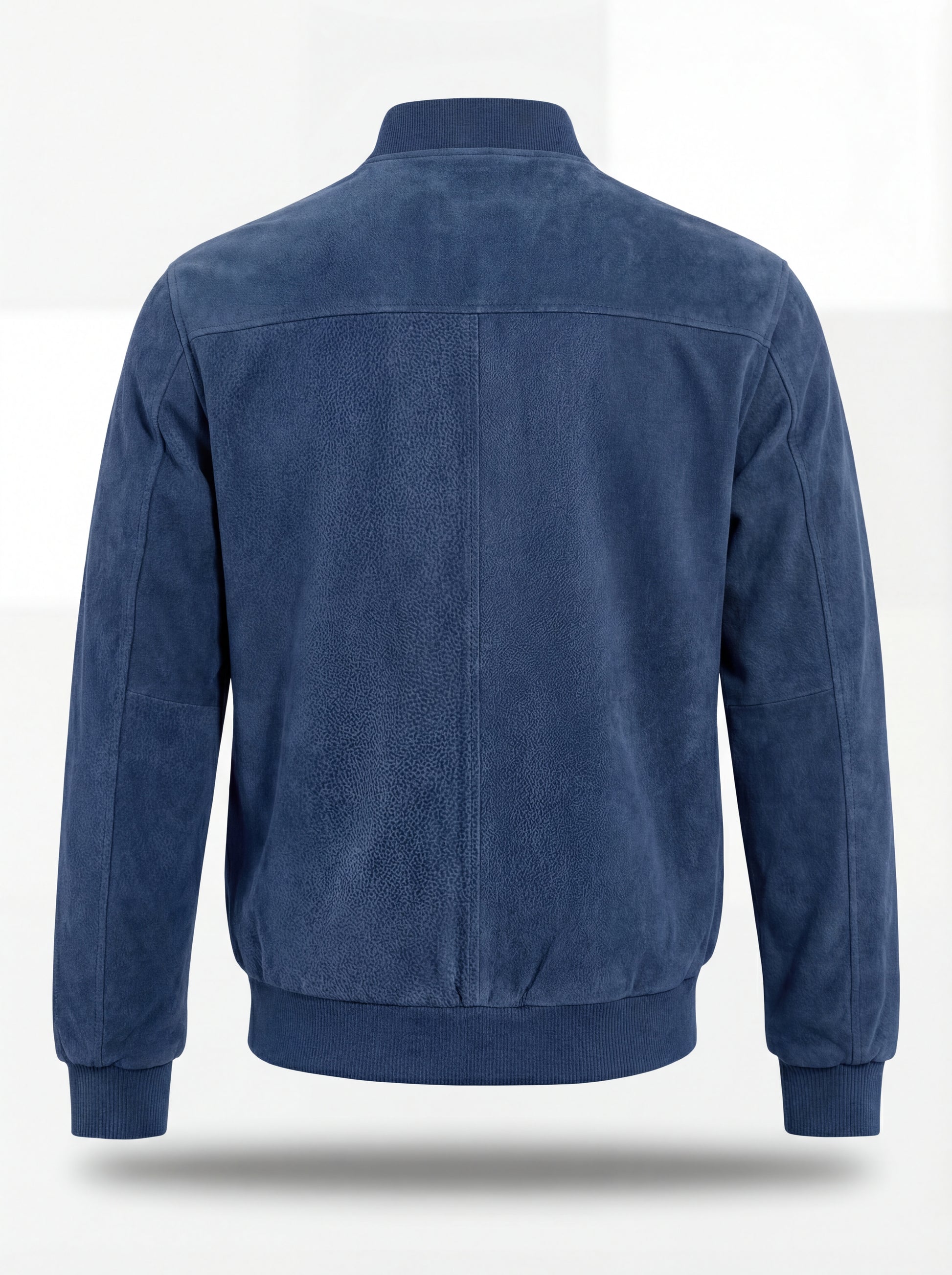 Rear view of blue suede bomber jacket showing clean back paneling and ribbed hem. The Jude by Maverick Jacket.
