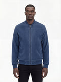 Male model wearing Maverick Jude suede bomber jacket, regular fit, styled with black jeans. Maverick Jacket.