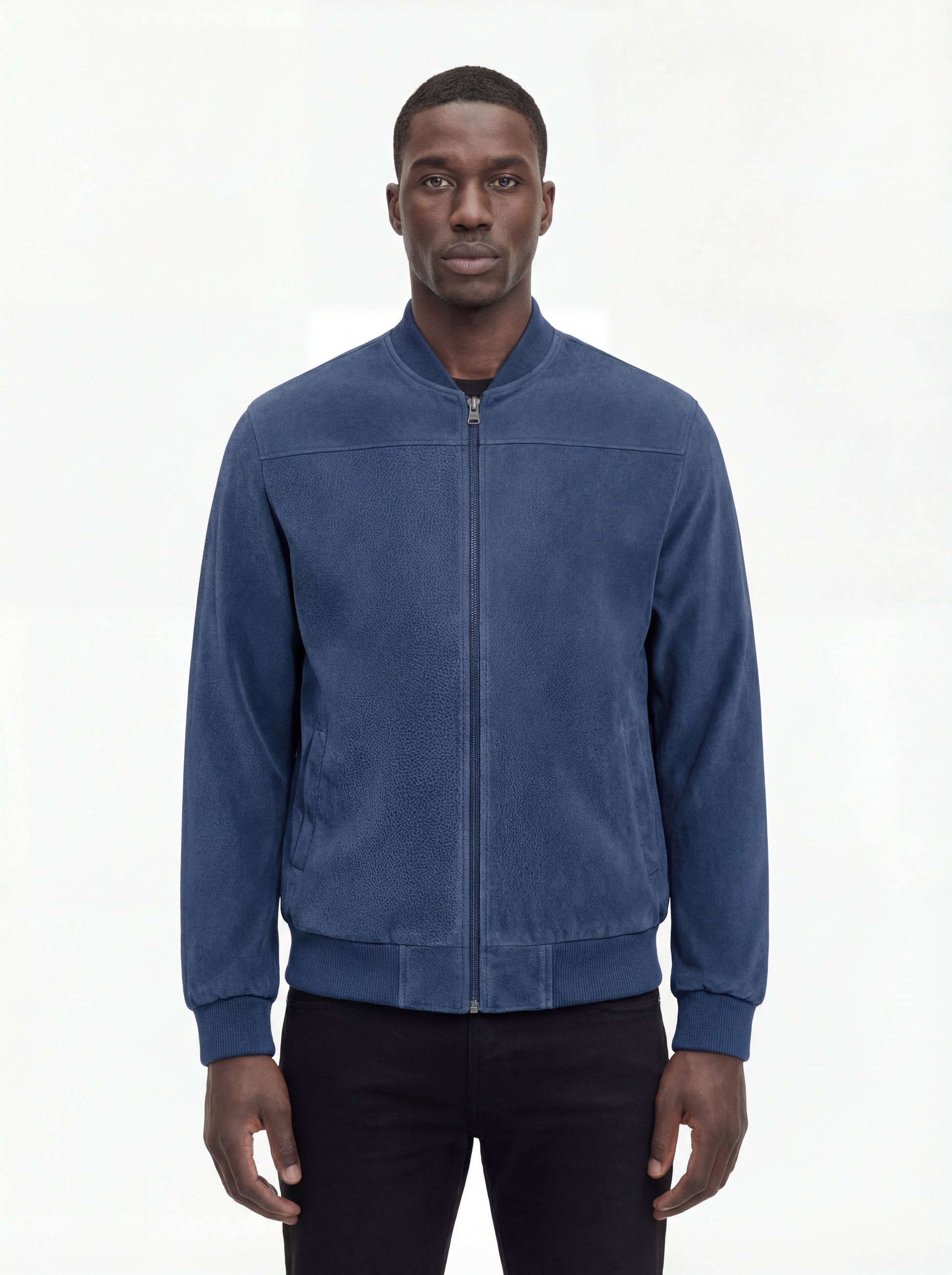 Male model wearing Maverick Jude suede bomber jacket, regular fit, styled with black jeans. Maverick Jacket.