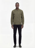 Male model wearing Maverick Evan suede bomber jacket, regular fit, styled with black jeans. Maverick Jacket.