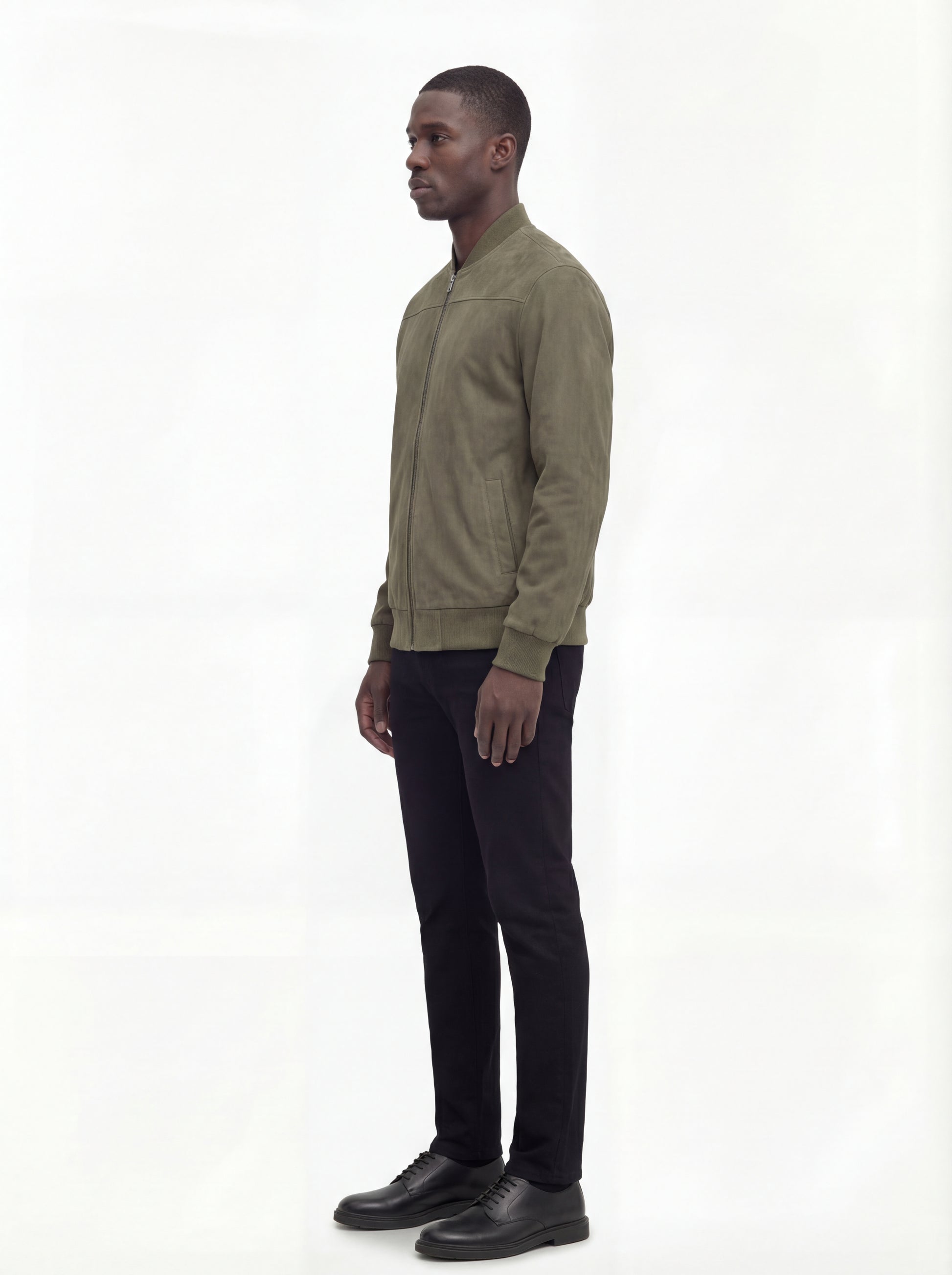 Side profile of Maverick Evan suede bomber jacket showing ribbed sleeve cuffs and classic bomber silhouette. Maverick Jacket.