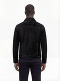 Rear view of male model wearing Maverick Lennon suede trucker jacket showing tailored shoulder fit and clean back paneling. Maverick Jacket.