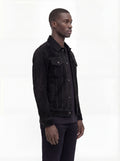 Side profile of Maverick Lennon suede trucker jacket showing sleeve cuff structure and straight torso silhouette. Maverick Jacket.