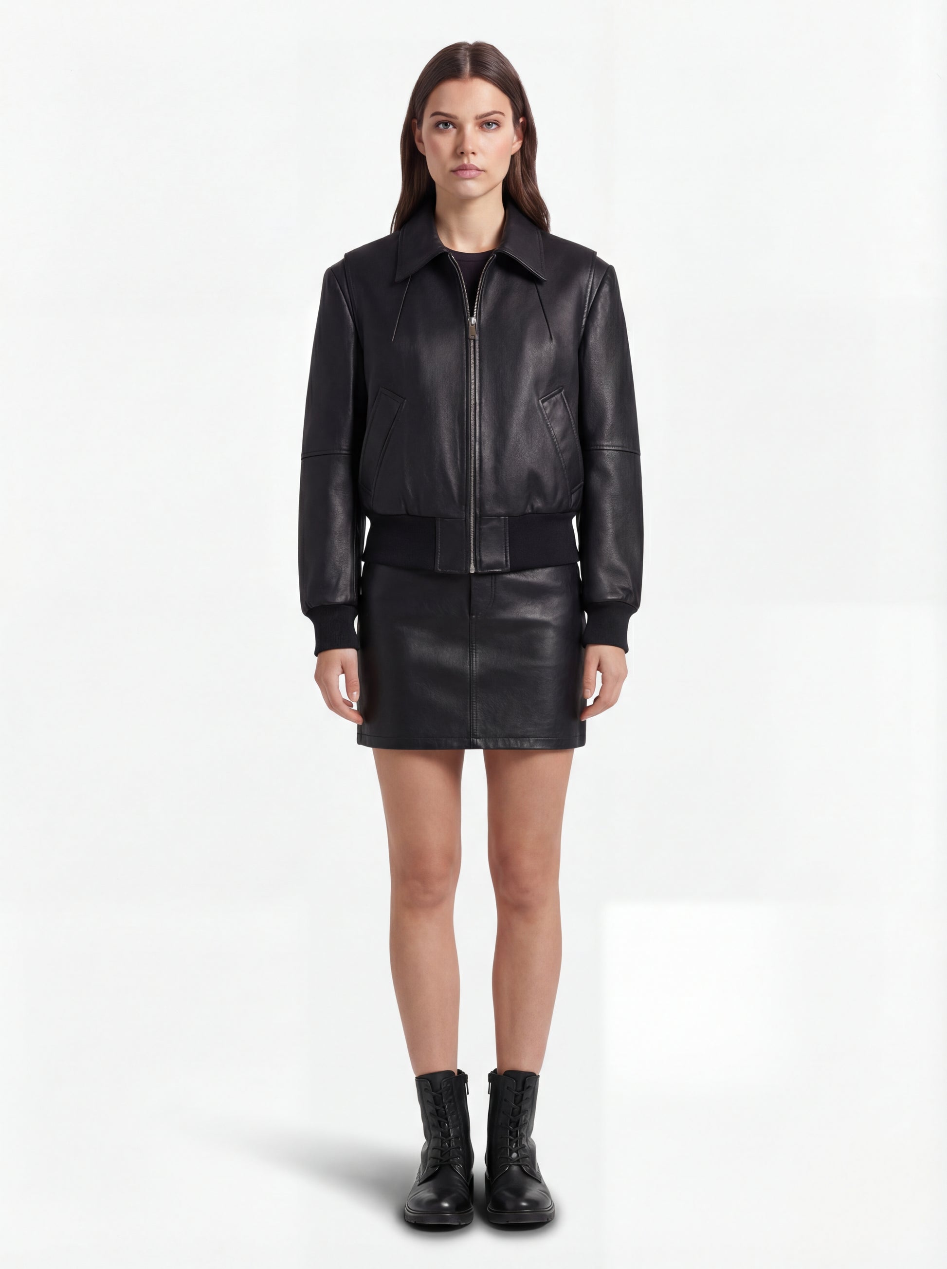 Female model wearing Maverick Isla leather bomber jacket, relaxed fit, styled with Maverick Orla black leather mini skirt. Maverick Jacket.