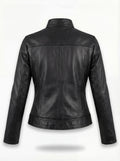 Rear view of black leather café racer jacket showing vertical center seam and contoured back paneling. The Maeve by Maverick Jacket.